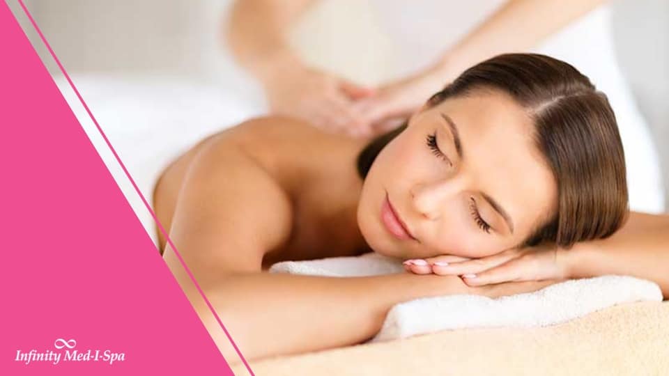 beautiful lady laying on a massage table with eyes closed and relaxed