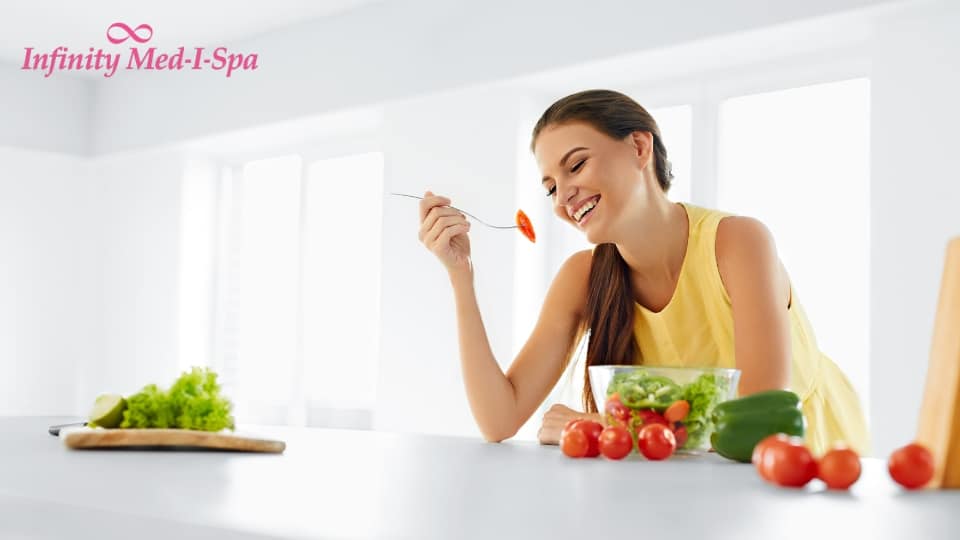 happy smiling woman eating a fresh salad