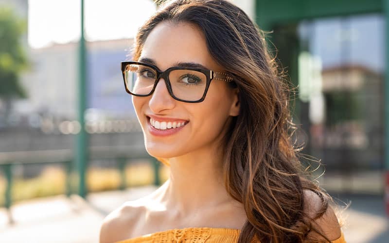 Women wearing glasses and smiling